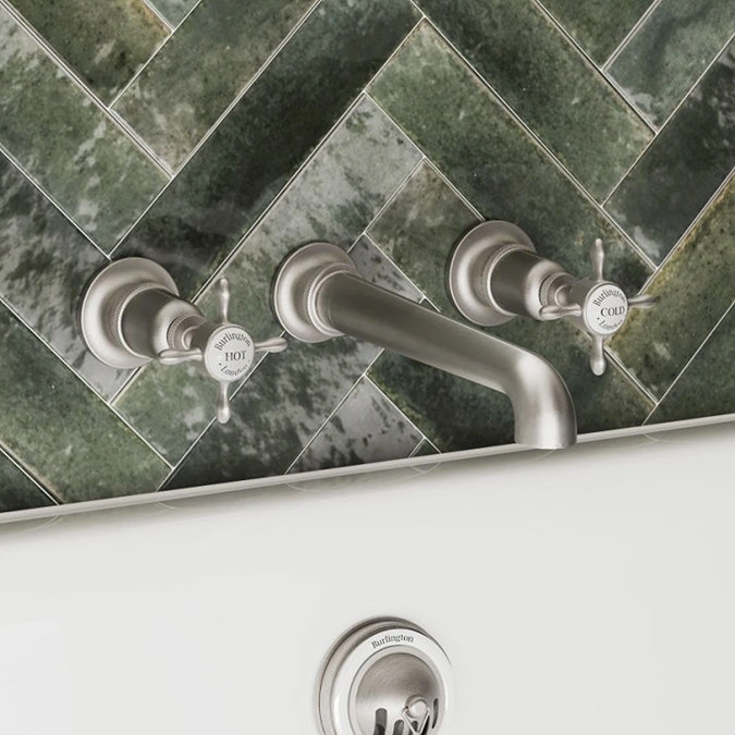 chrome-taps-on-green-tiles