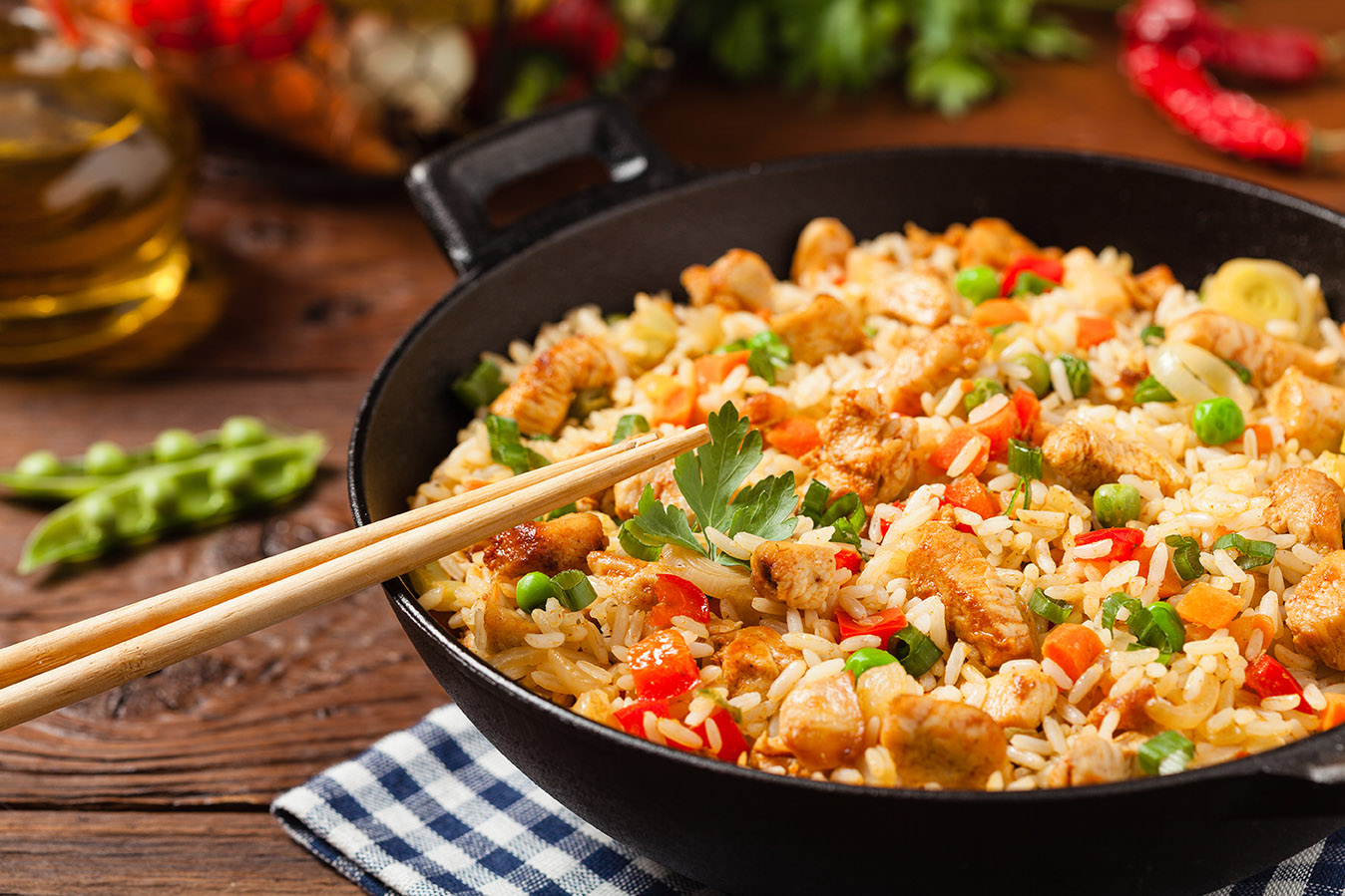 Fried rice with chicken. Prepared and served in a wok.